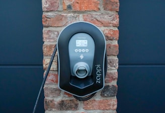 black and gray wall mounted telephone